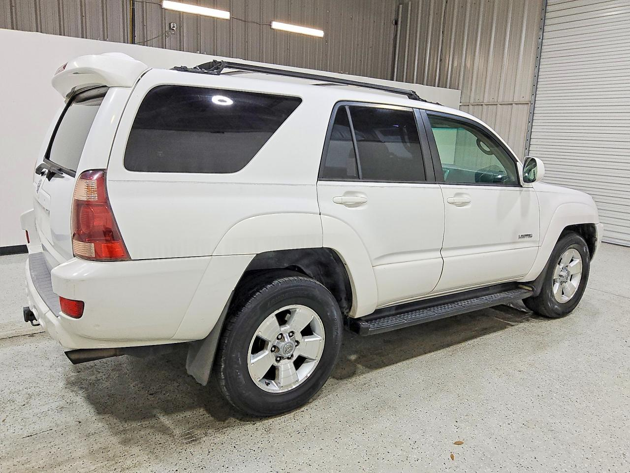 Damaged white Toyota SUV bought by a Fremont wrecked car buyer